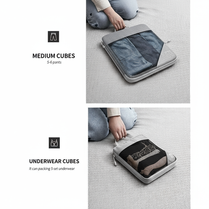 Gray packing cubes with denim jeans and underwear being used for packing on a light gray background.