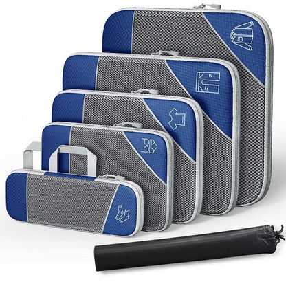Set of blue and gray packing cubes with a black rolling travel mat on a white background