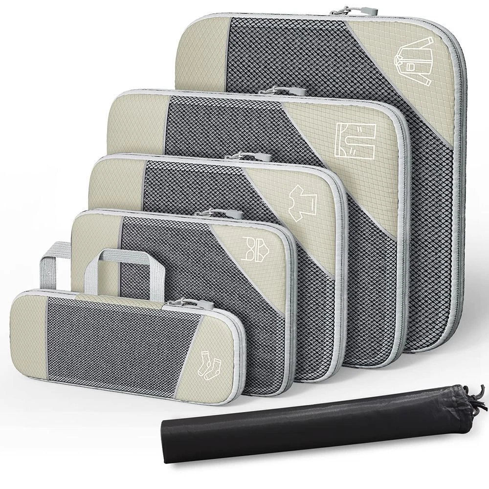 Set of gray and beige packing cubes with a black compression sock on a white background